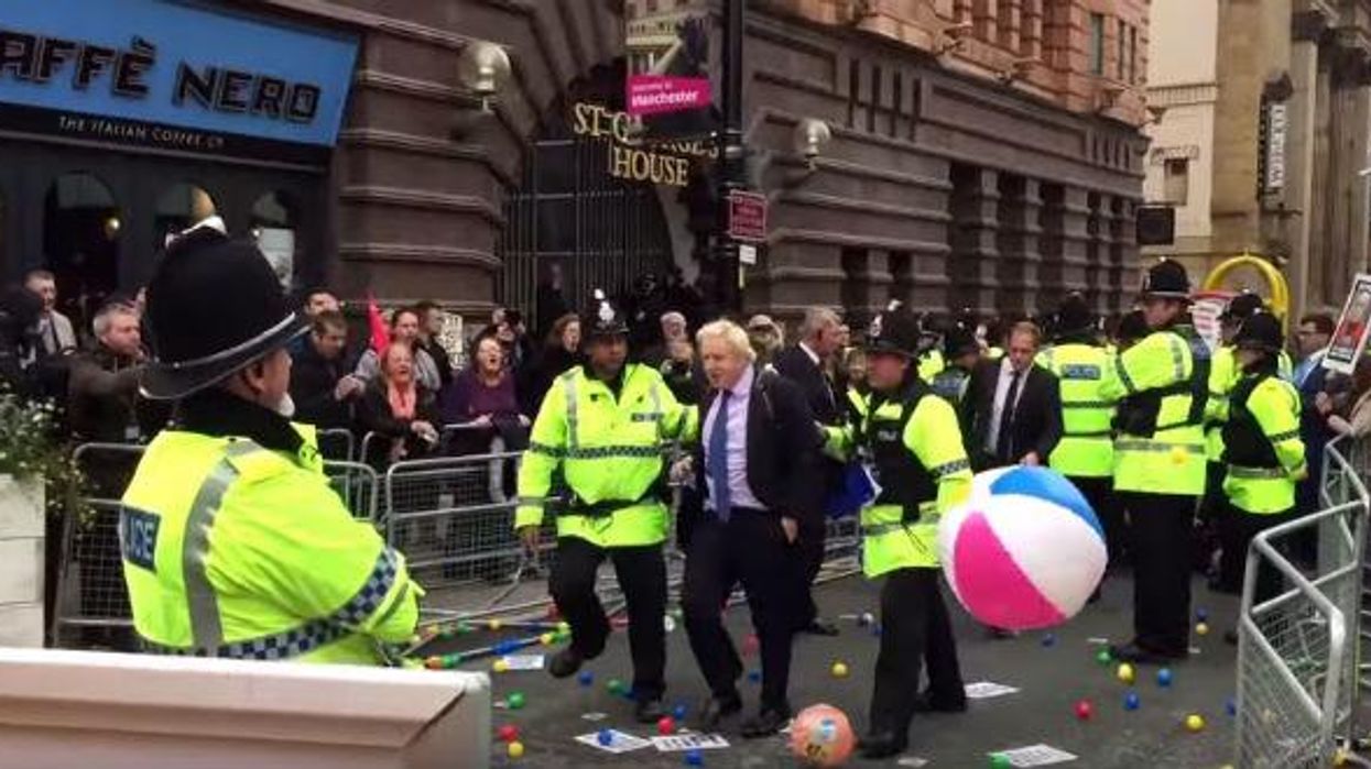 Boris Johnson pelted with balls at Tory conference