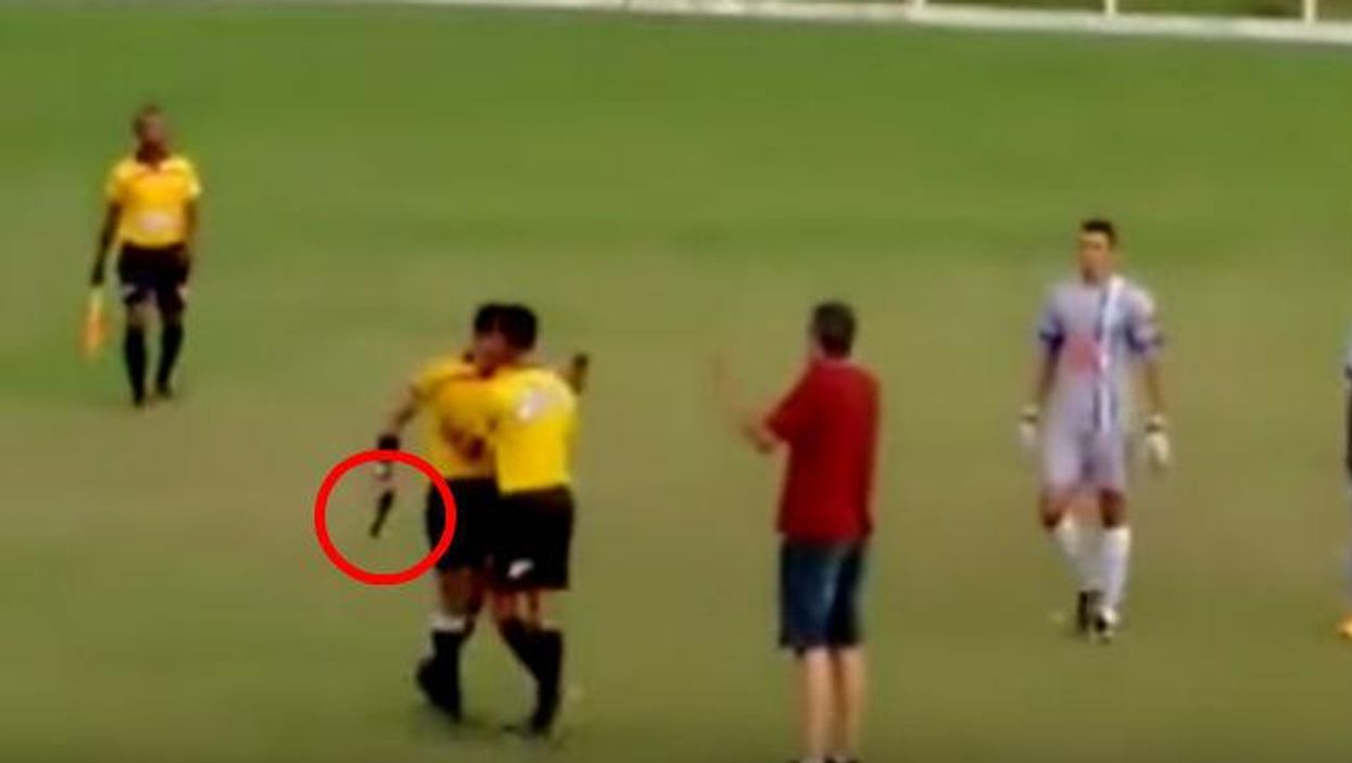 This football referee was kicked, in response he pulled a gun