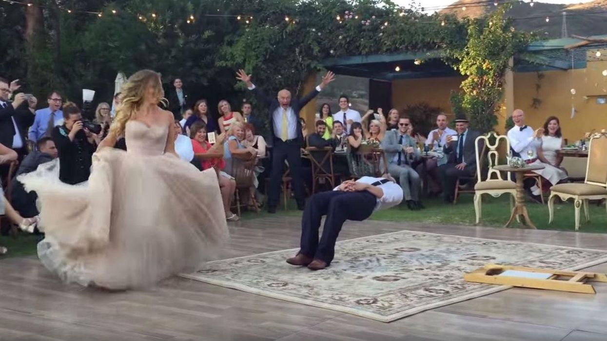 Groom actually appears to levitate in this spectacular first wedding dance