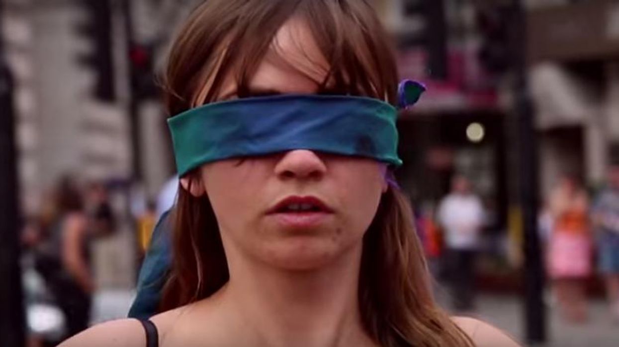 This woman stood blindfolded in her underwear in central London to promote self-acceptance