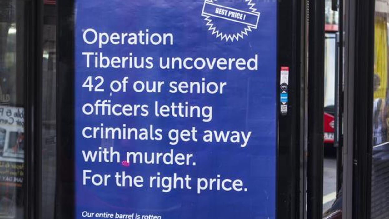 Someone keeps on putting up awkward anti-police posters outside Scotland Yard