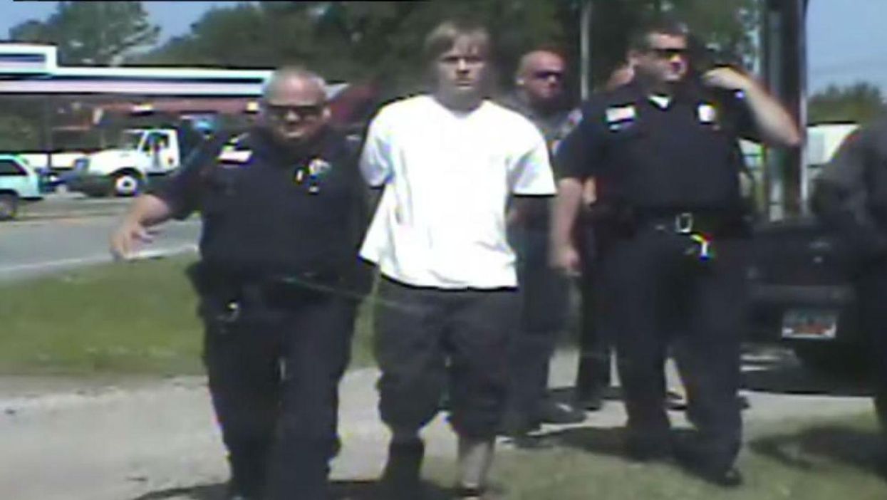 Police officers high five in video footage of Dylann Roof arrest