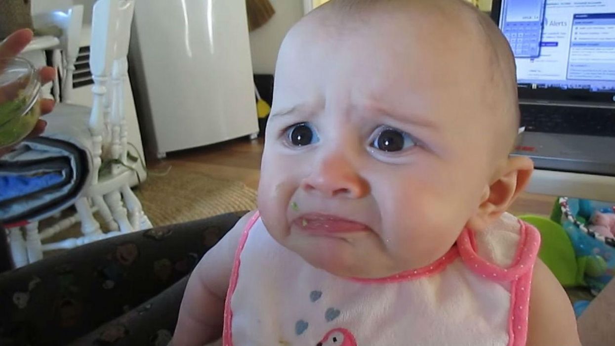 Parents try to feed their baby avocado for the first time, she absolutely hates it