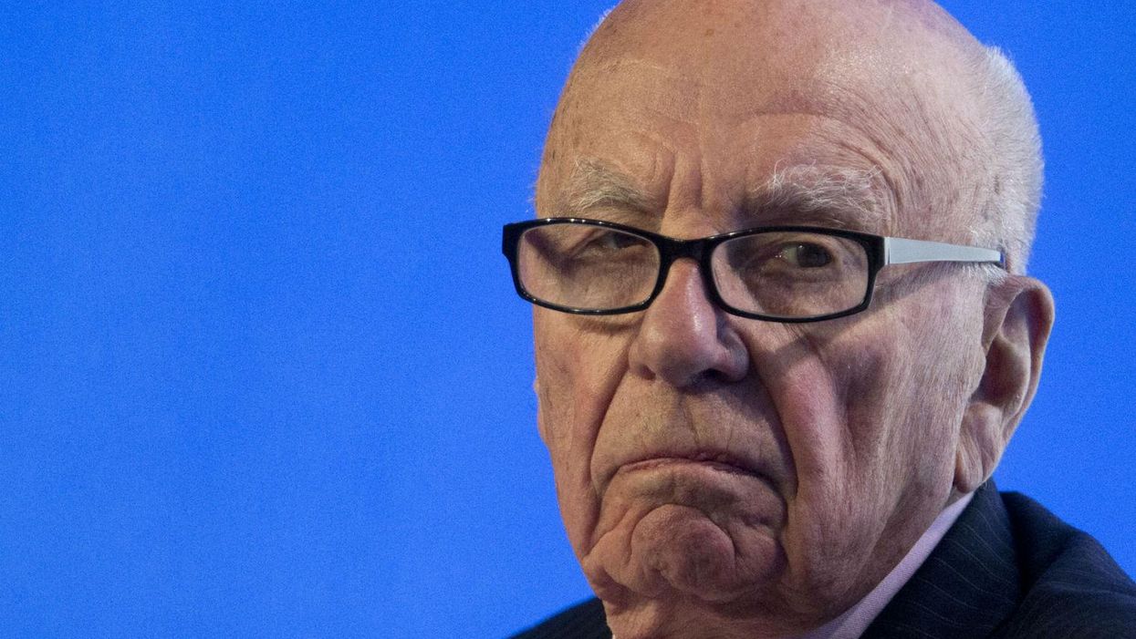 Rupert Murdoch's News Corp empire has just seen its profits halved
