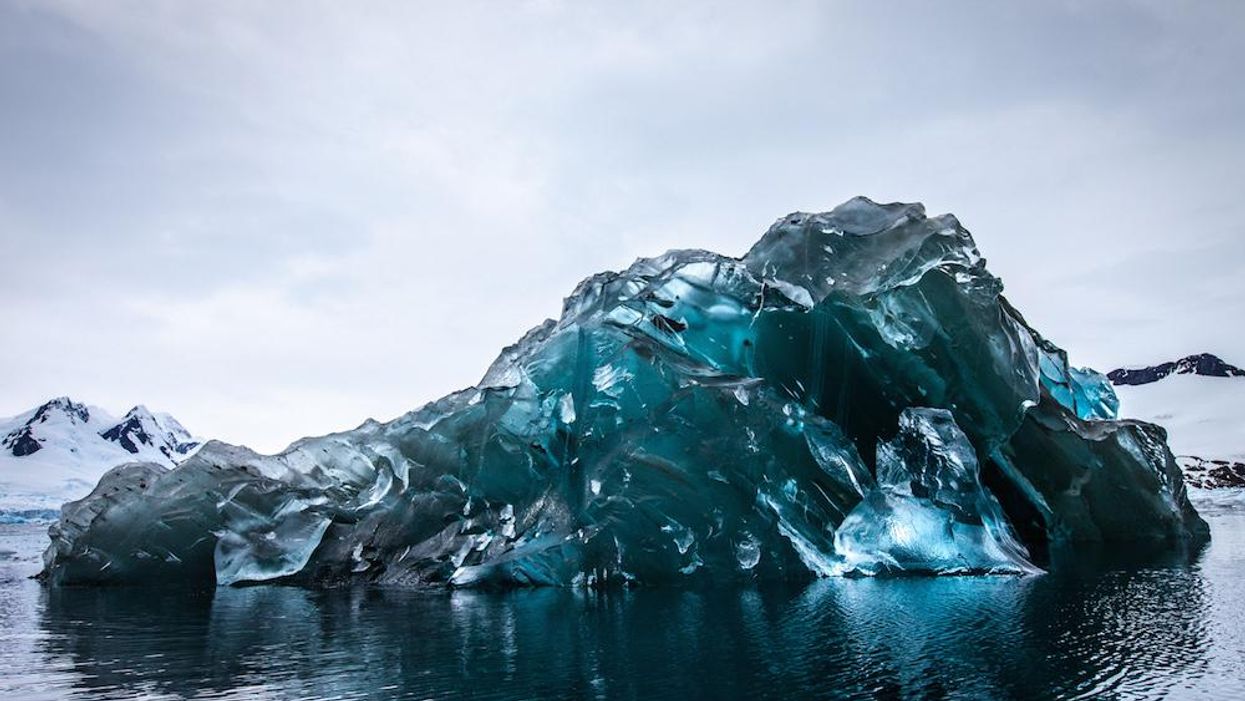 These pictures of a flipped iceberg are simply stunning