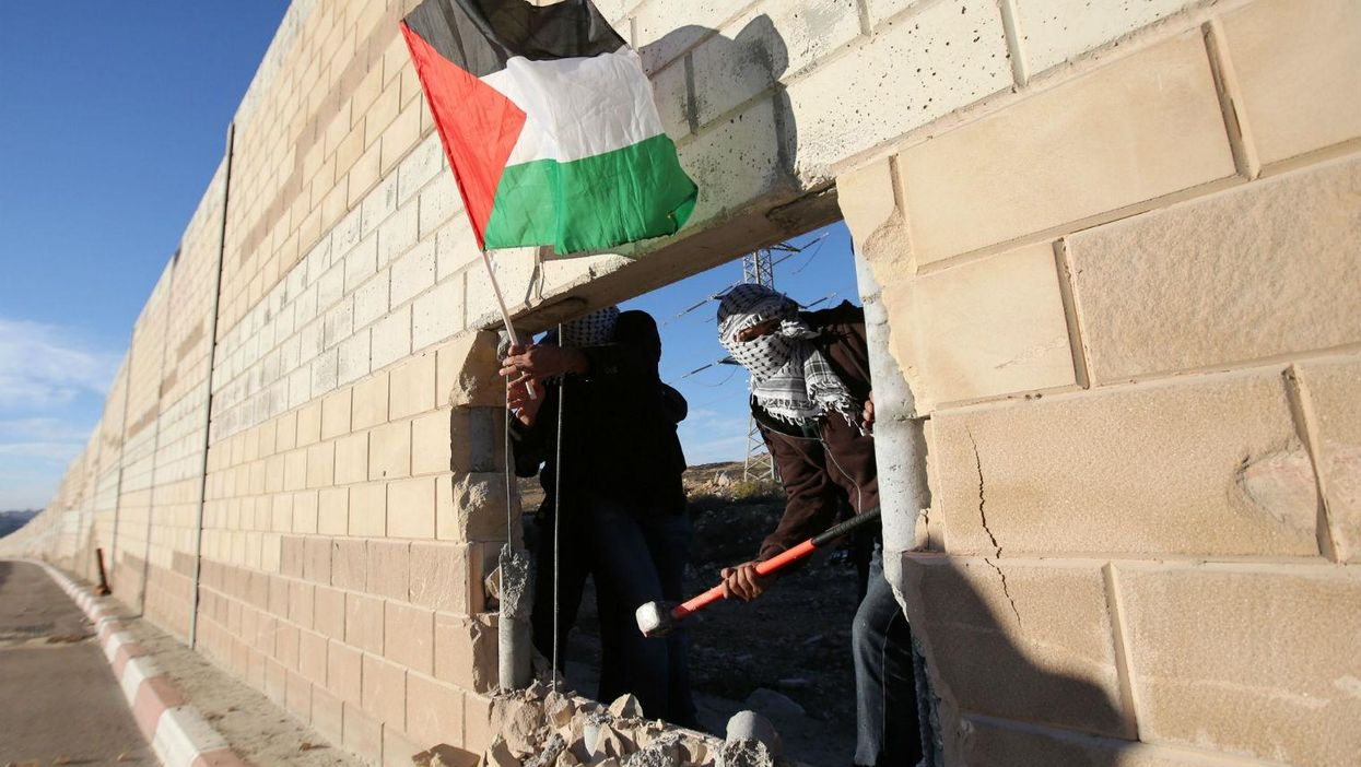 25 years since Berlin Wall fell, Palestinians smash West Bank barrier
