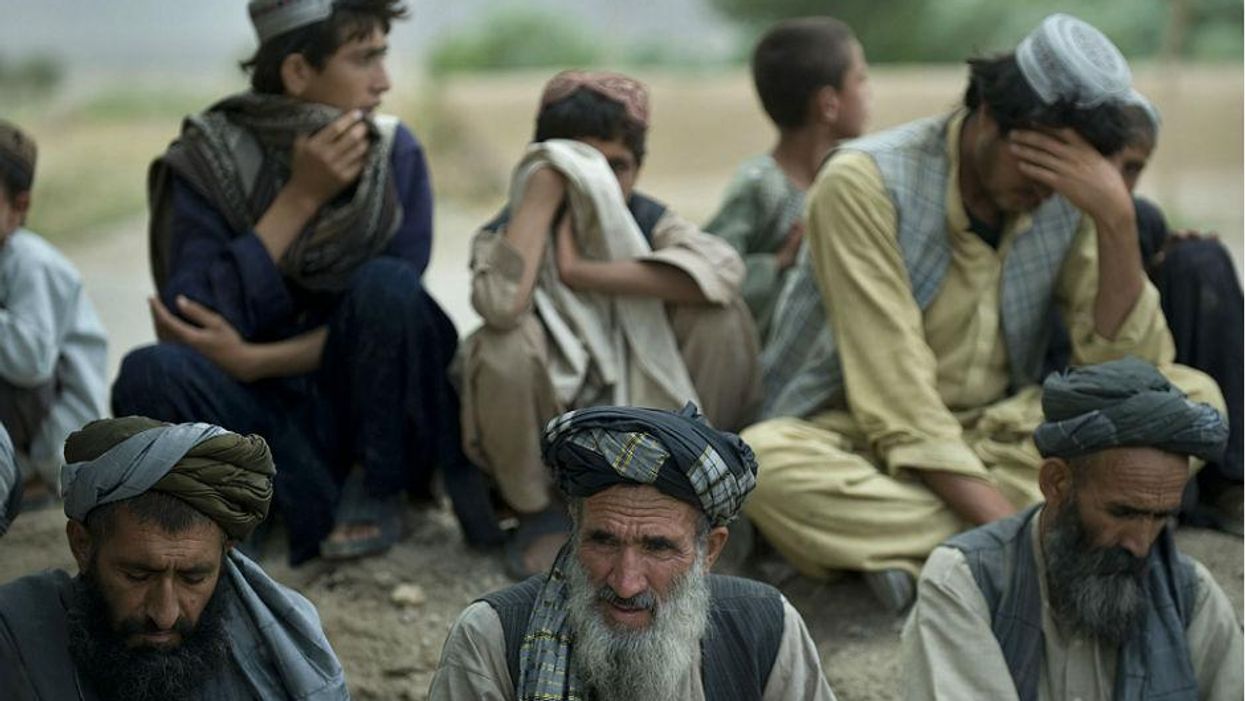 How many Afghan civilians have died in 13 years of war?
