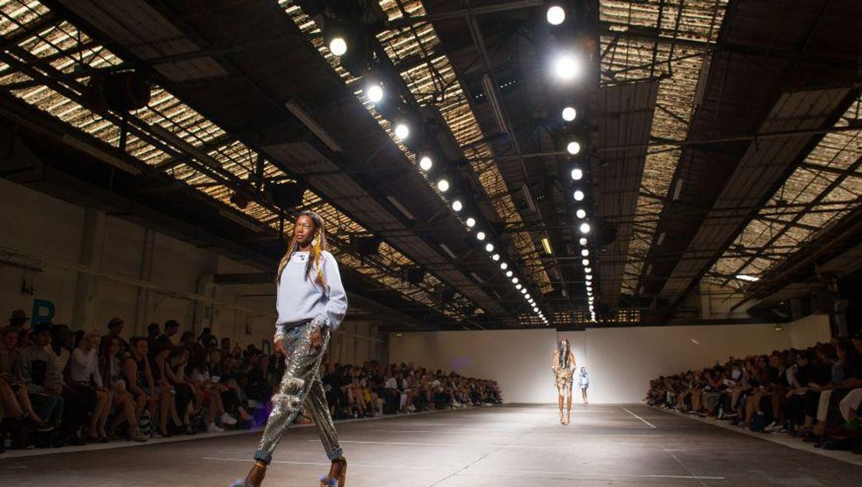 Man falls through roof at fashion show, show goes on regardless