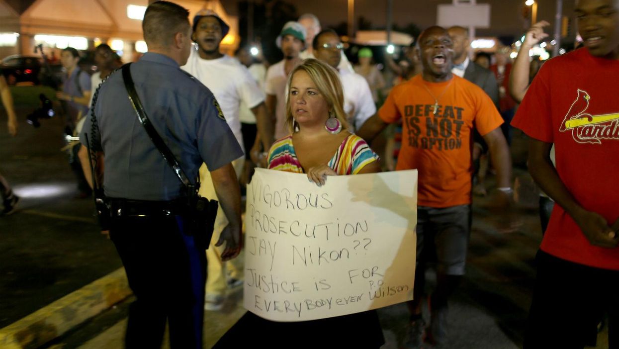 Two white protesters arrived in Ferguson with pro-police signs