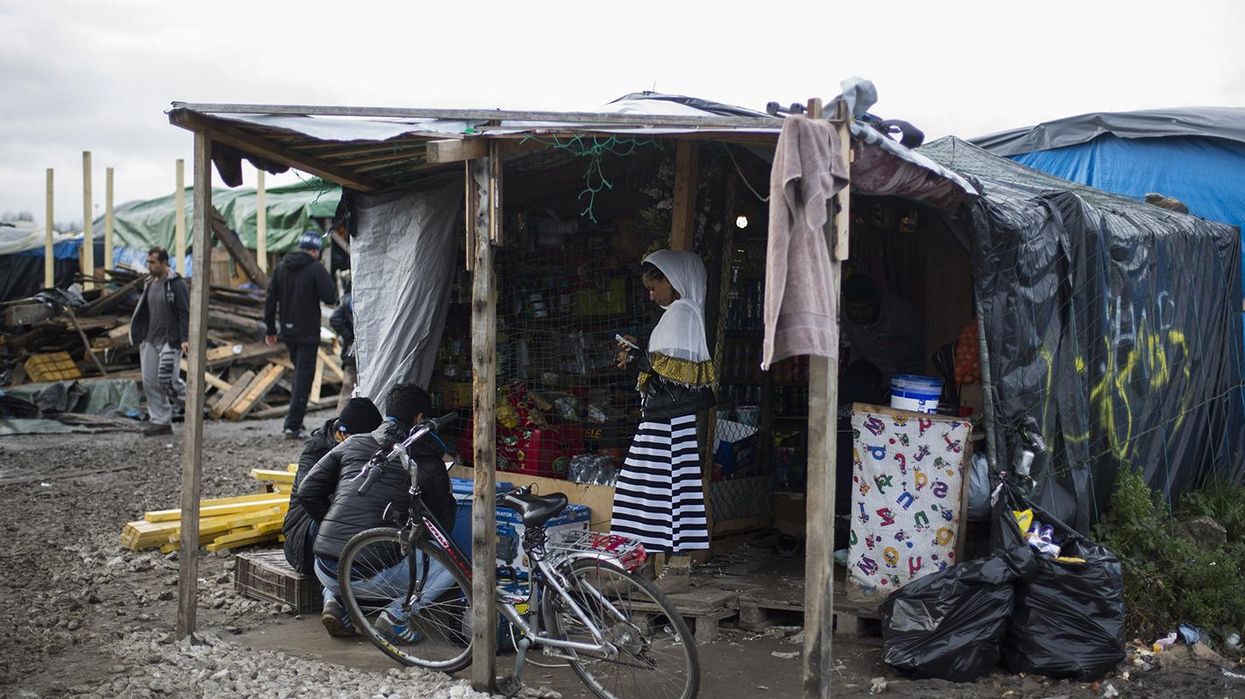 Yes, the Jungle in Calais was on fire. No, it is nothing to do with the Paris terror attacks