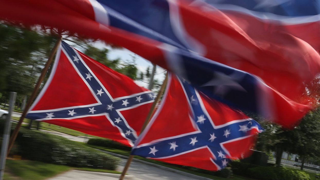 Man wears Confederate flag t-shirt with noose to vote in the midterm elections