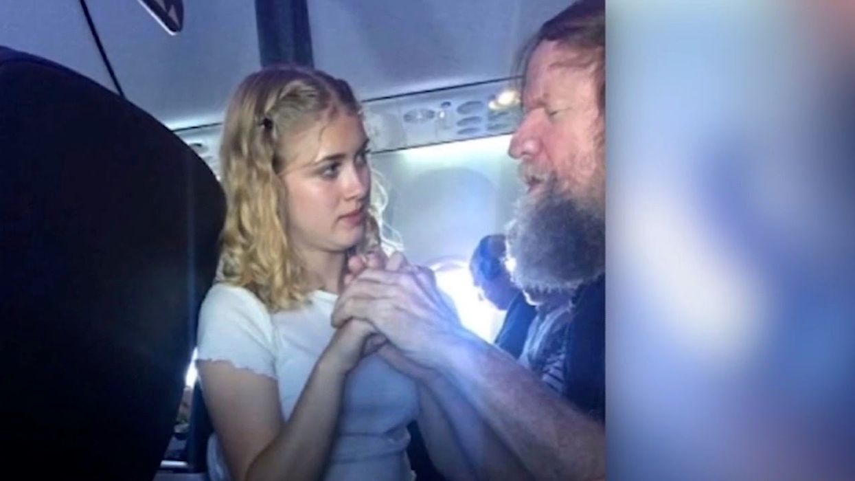 Teenager praised for video in which she helps blind and deaf man on plane communicate using sign language