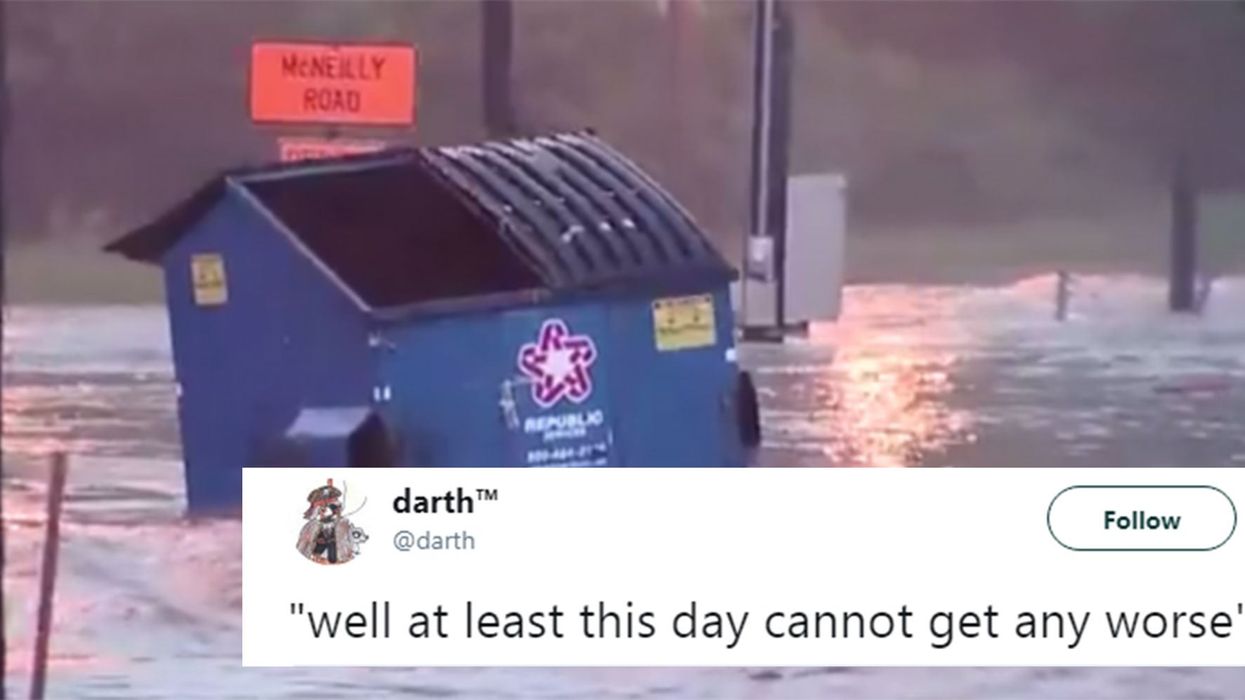 This dumpster floated down a flooded highway and instantly became a meme