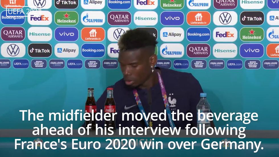 Pogba removes beer bottle from press conference table