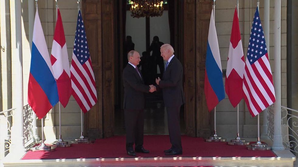Biden and Putin shake hands at summit venue ahead of talks