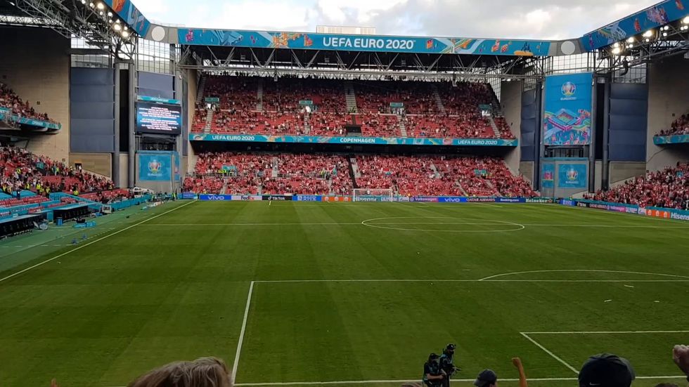 Fans chant in support of Christian Eriksen after footballer collapsed on pitch