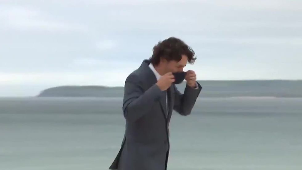 G7: Canadian Prime Minister Justin Trudeau puts on mask to greet Boris and Carrie