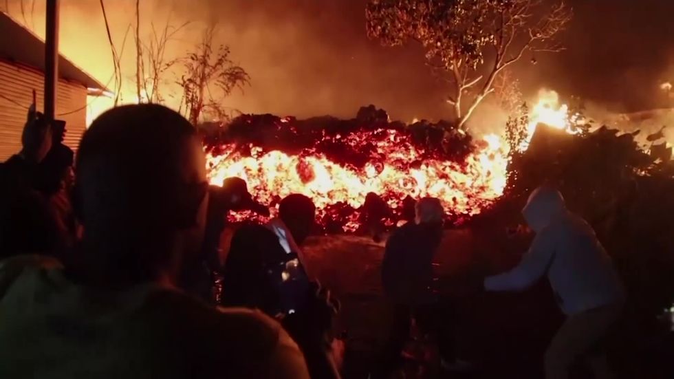 Residents try to stop lava reaching DR Congo village after volcano eruption