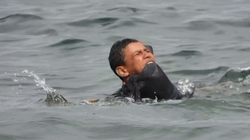 Migrant boy swims to Spain's Ceuta with plastic bottles to stay afloat
