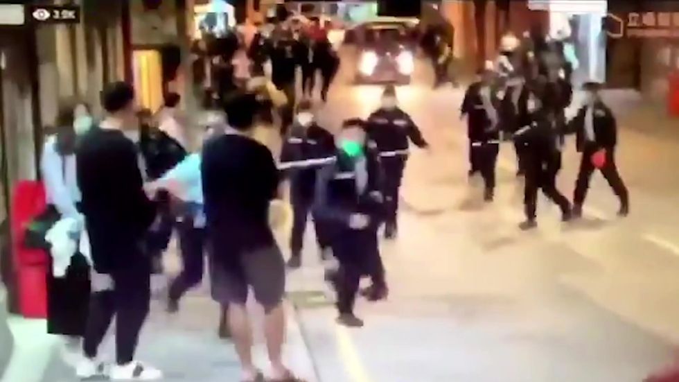 Hong Kong police launch 'ambush-style lockdown' to carry out forced Covid testings