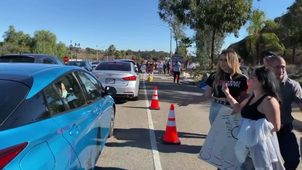 Anti-vaxxers intimidating people waiting to get the Covid-19 vaccine