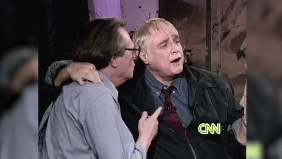 Marlon Brando kisses Larry King