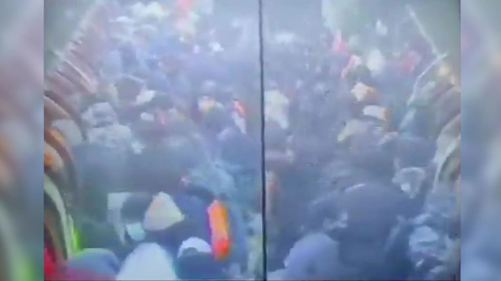 Coronavirus: CCTV shows worrying amount of travellers boarding tube at Canning Town station