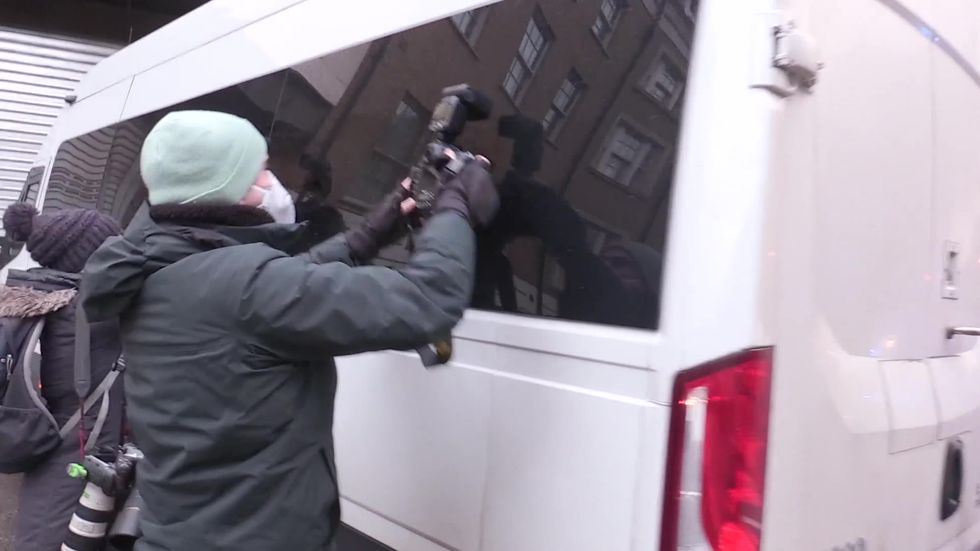 Julian Assange arrives at Westminster Magistrates' Court in police van