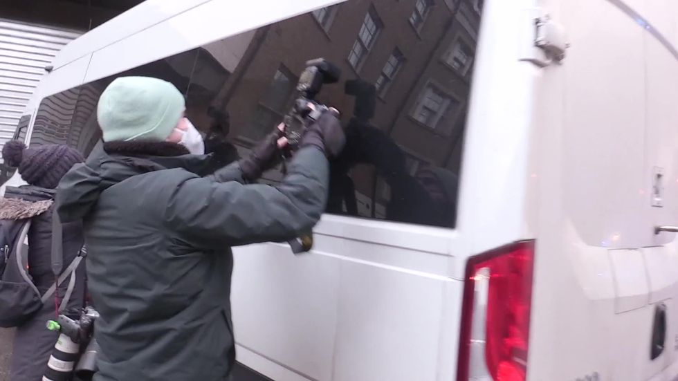 Julian Assange arrives at Westminster Magistrates' Court in police van
