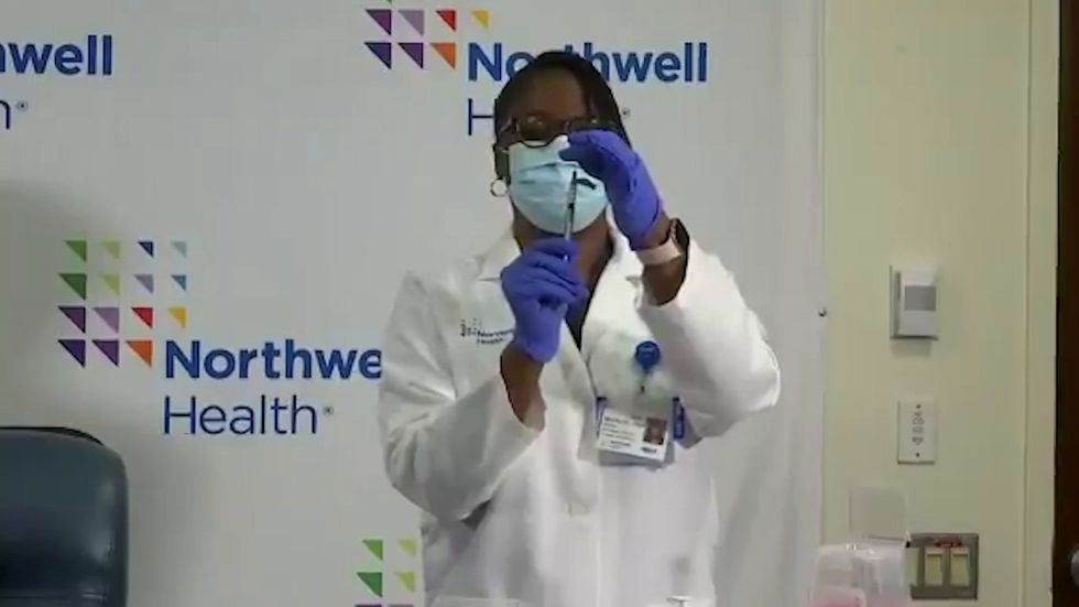 New York nurse is first in US to be fully vaccinated after receiving second jab