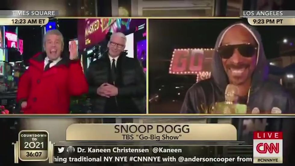 Andy Cohen, Anderson Cooper and Snoop Dogg play a game on CNN's New Year's Eve coverage