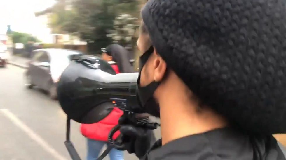 Protesters march on Tottenham police station following stop and search video