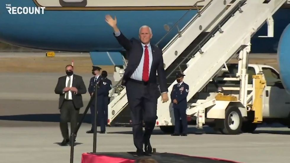 Mike Pence running and clapping at the same time