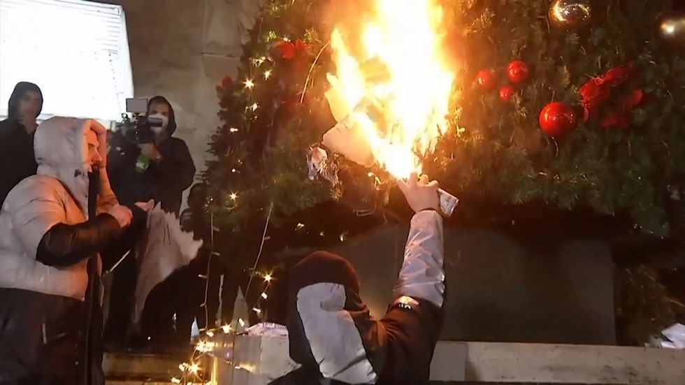 Protestors burn Christmas tree in Albania after man ‘killed for breaking coronavirus curfew’