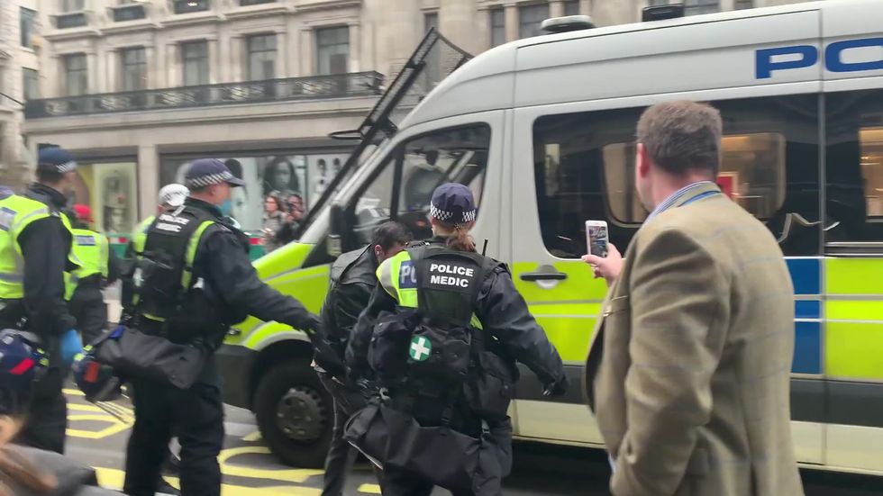 Protesters detained by police in anti-lockdown demo in London