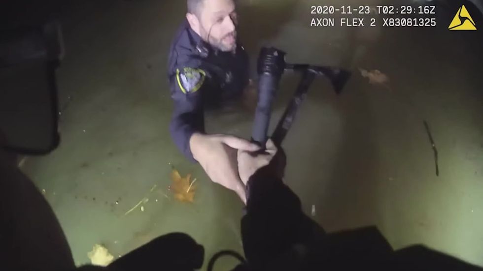 Moment woman is dramatically rescued from freezing Ohio river