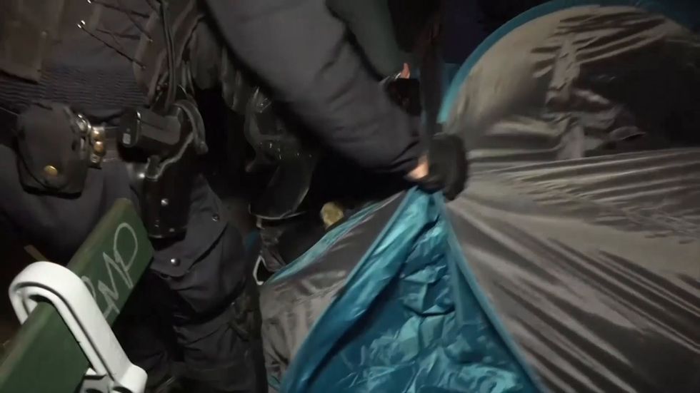 Paris officers filmed tossing migrants out of tents while evacuating protest camp
