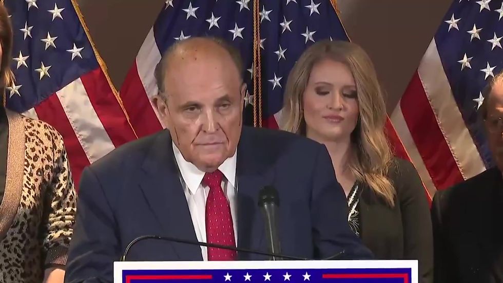 Rudy Giuliani's hair dye drips down his face during press conference