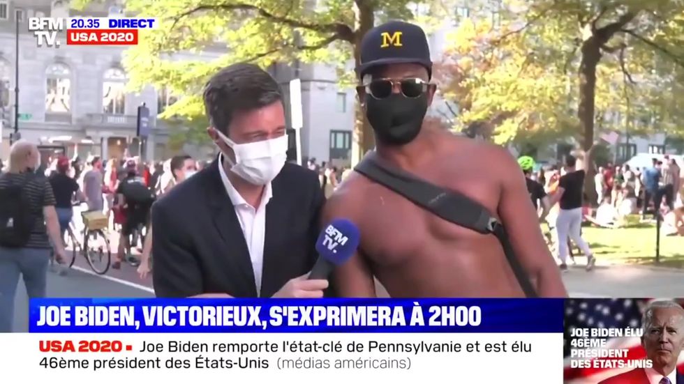 French reporter laughs after being interrupted by man at Biden victory celebrations