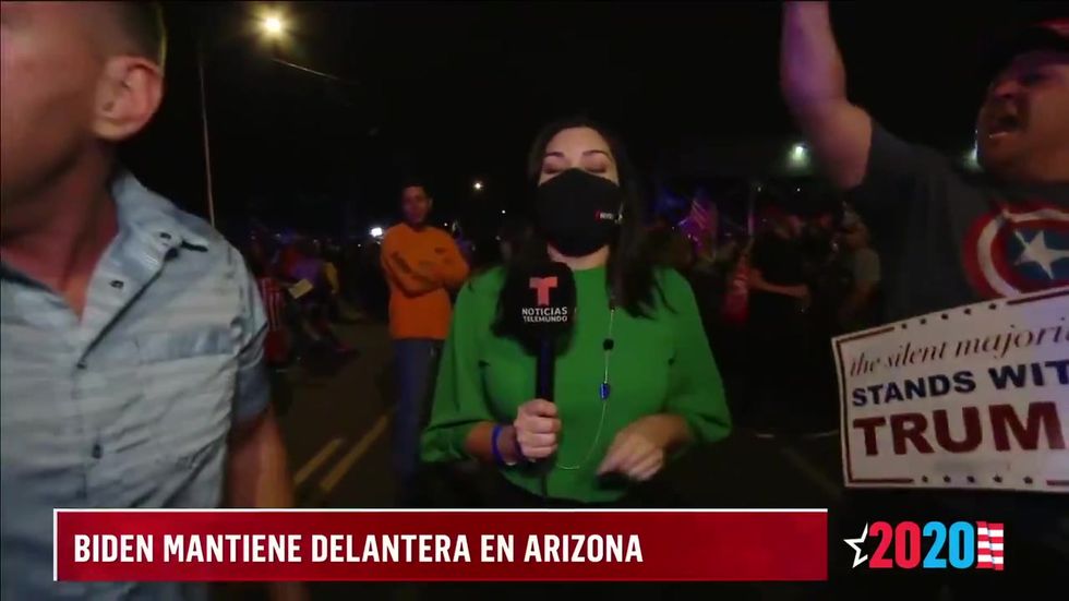 Trump supporters not wearing masks scream at Telemundo reporter outside Arizona count