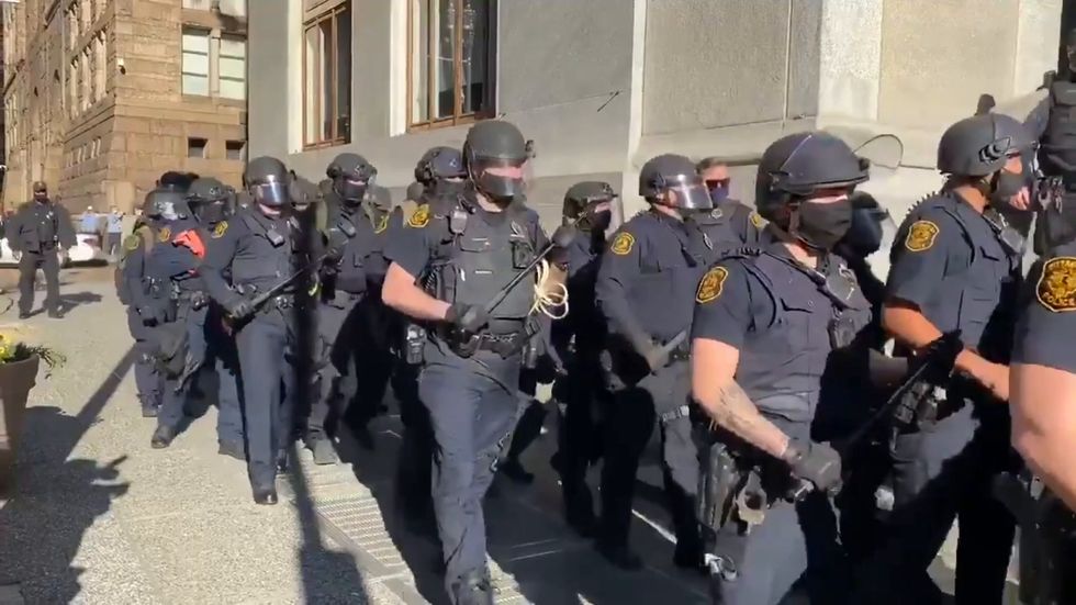Riot police arrive in Pittsburgh where protesters are gathered