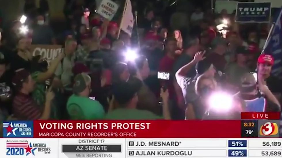 Armed Trump supporters gather at key Arizona vote counting facility