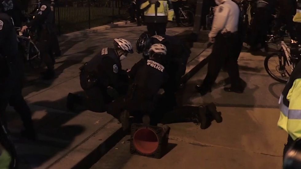 Police and protesters clash at Election Day demonstration in Washington DC