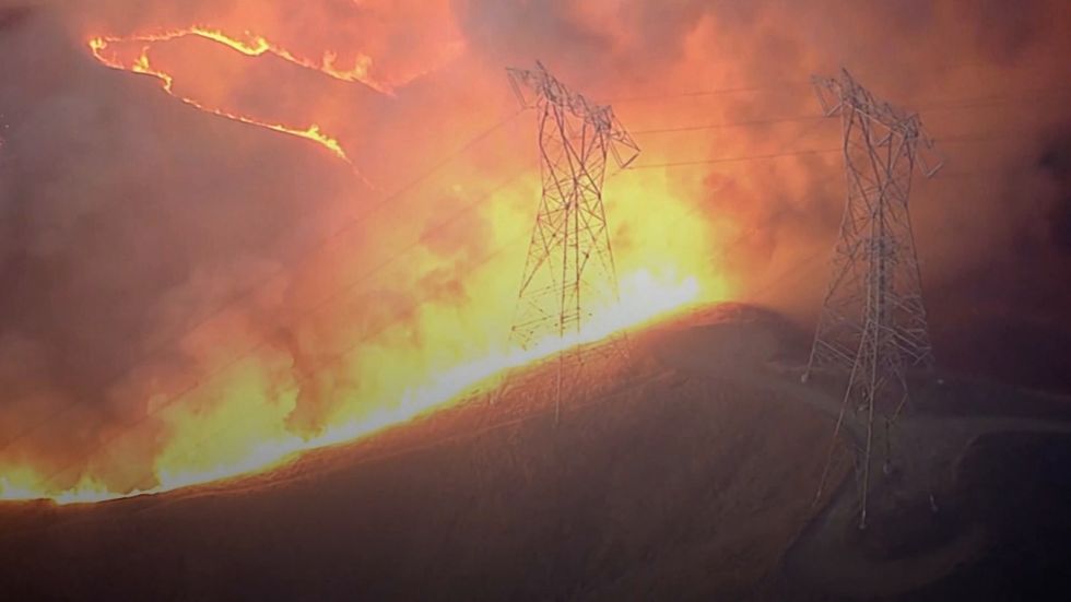 Tens of thousands evacuated as crews battle California wildfires