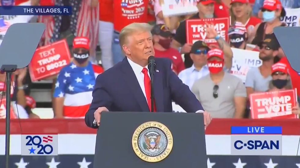 Trump fan appears to make white power OK sign at rally
