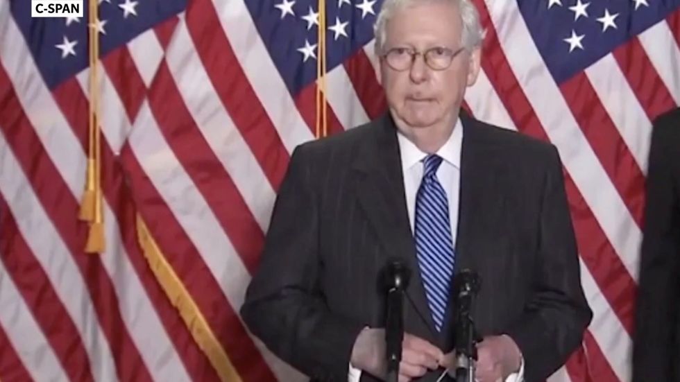 Mitch McConnell’s hand is discoloured and bandaged – but he insists nothing is wrong