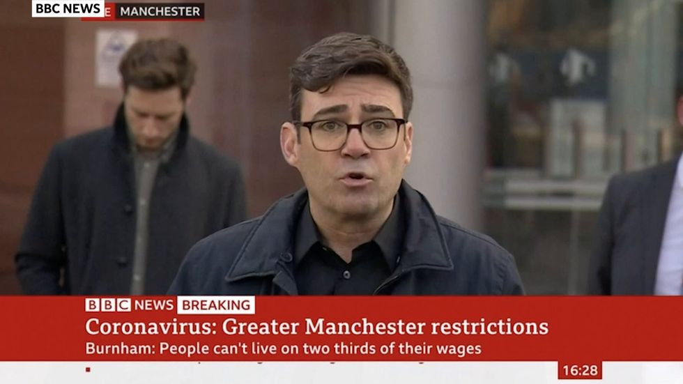 Andy Burnham accuses government of “playing poker” with people’s lives