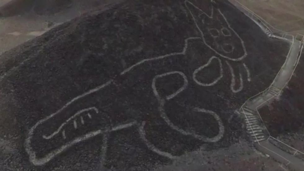 Drone footage reveals ancient cat etched into Peru hillside