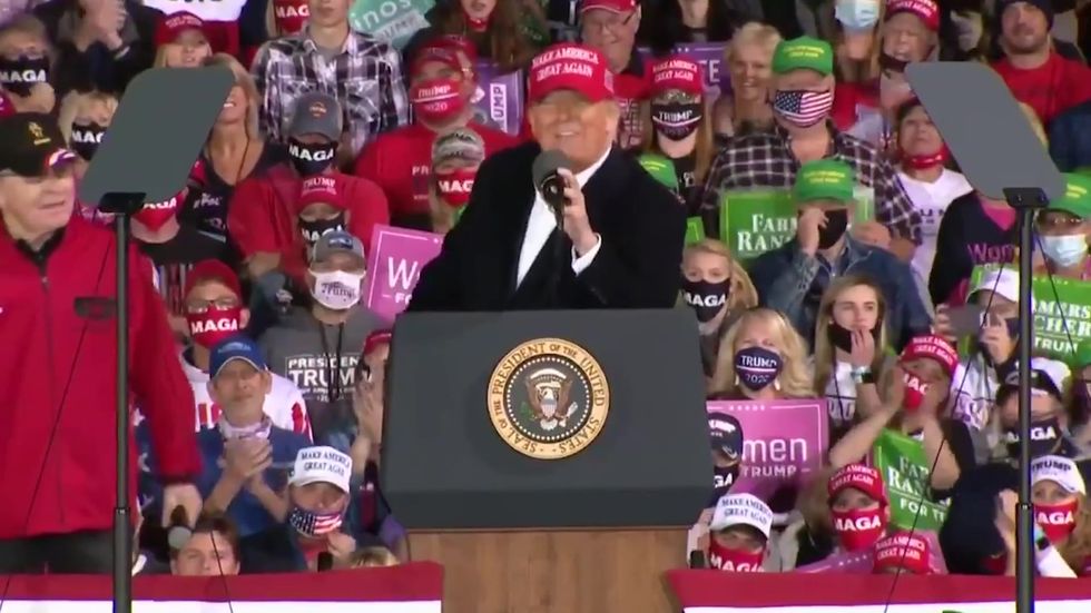 Trump invites wary 71-year-old wrestling legend on stage at rally