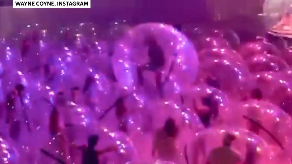 The Flaming Lips perform in giant bubbles